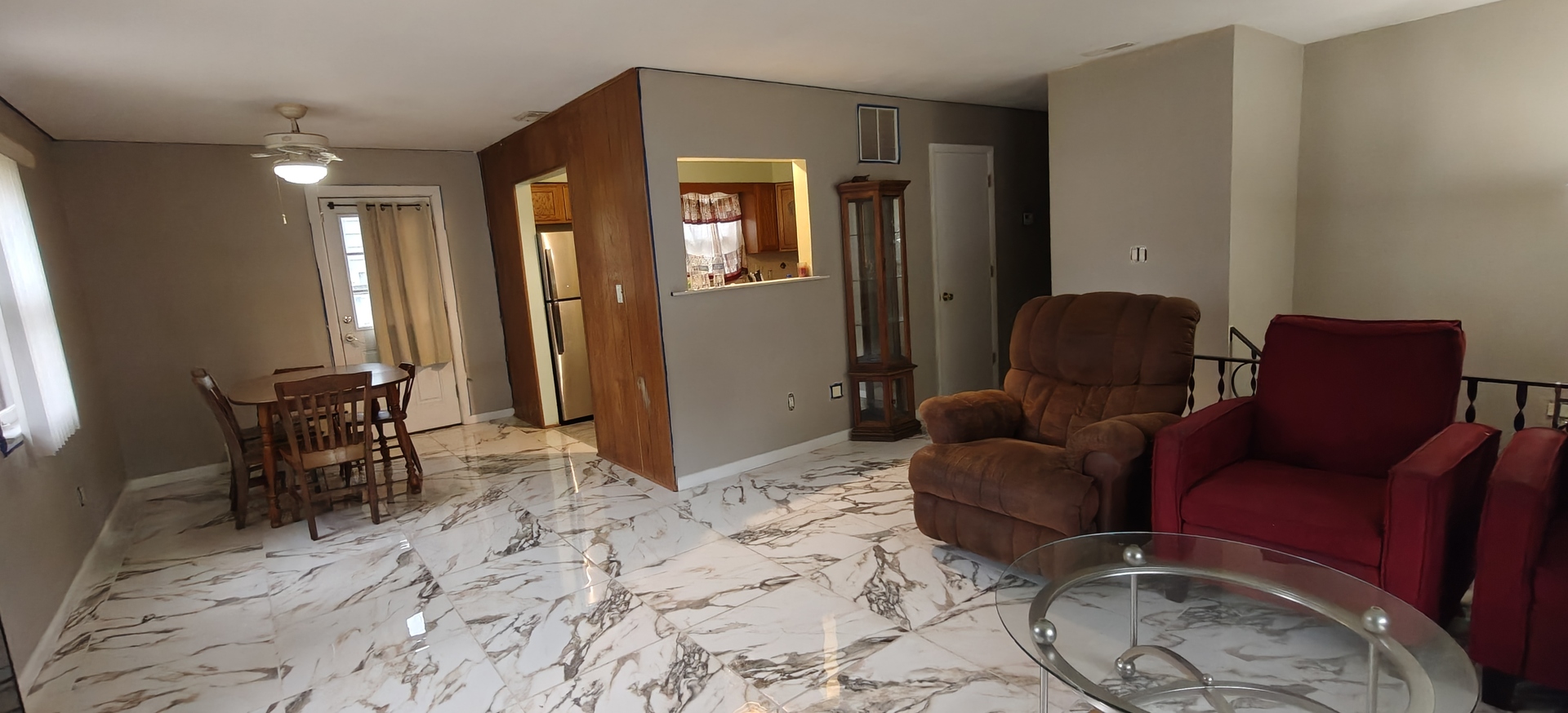 4515 Raven Street Rockford, IL 61107 - Photo 8 of 22 a living room with furniture a dining table and chairs with wooden floor