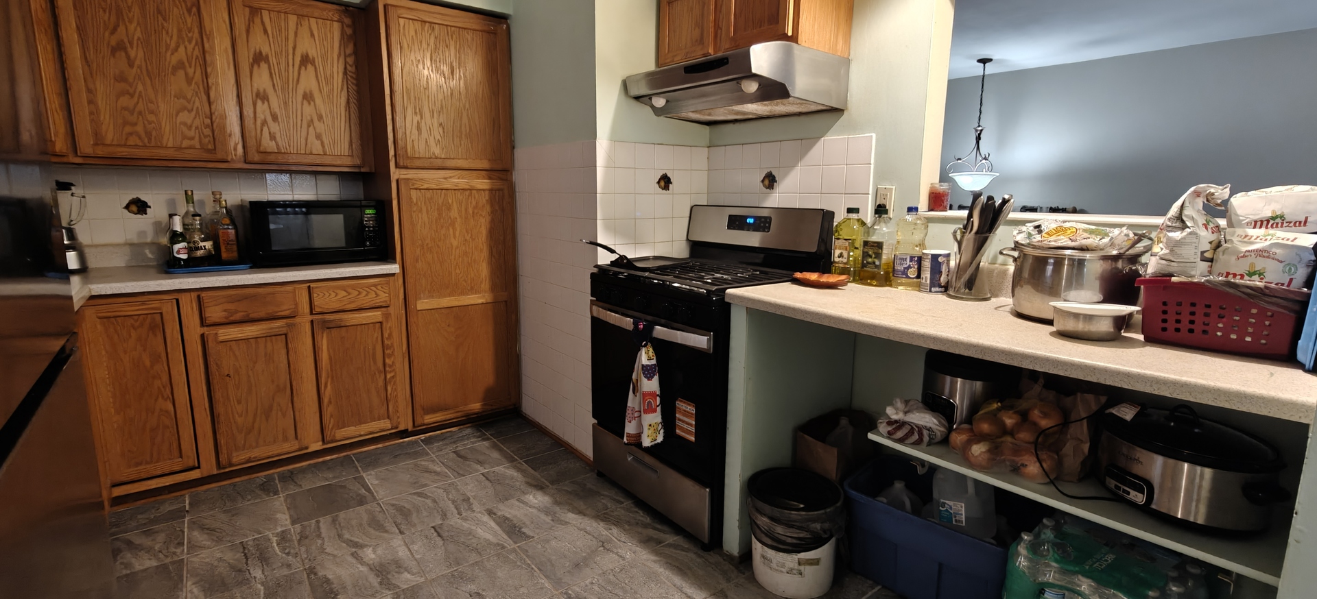 4515 Raven Street Rockford, IL 61107 - Photo 9 of 22 a kitchen with stainless steel appliances granite countertop a sink stove and cabinets