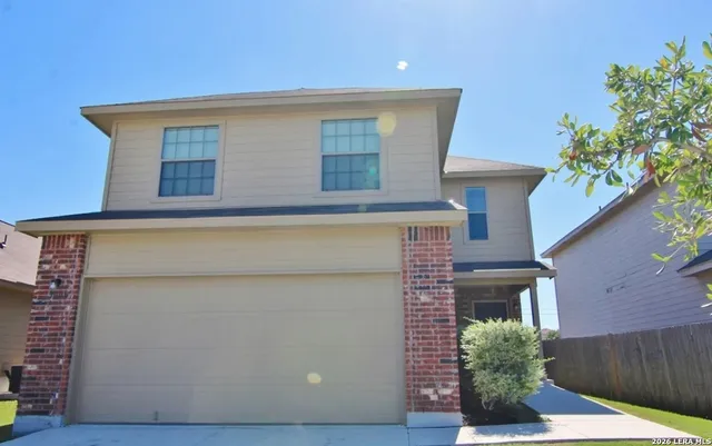 a view of a backyard with a small pool