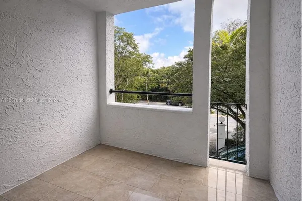 a room with a bed and window