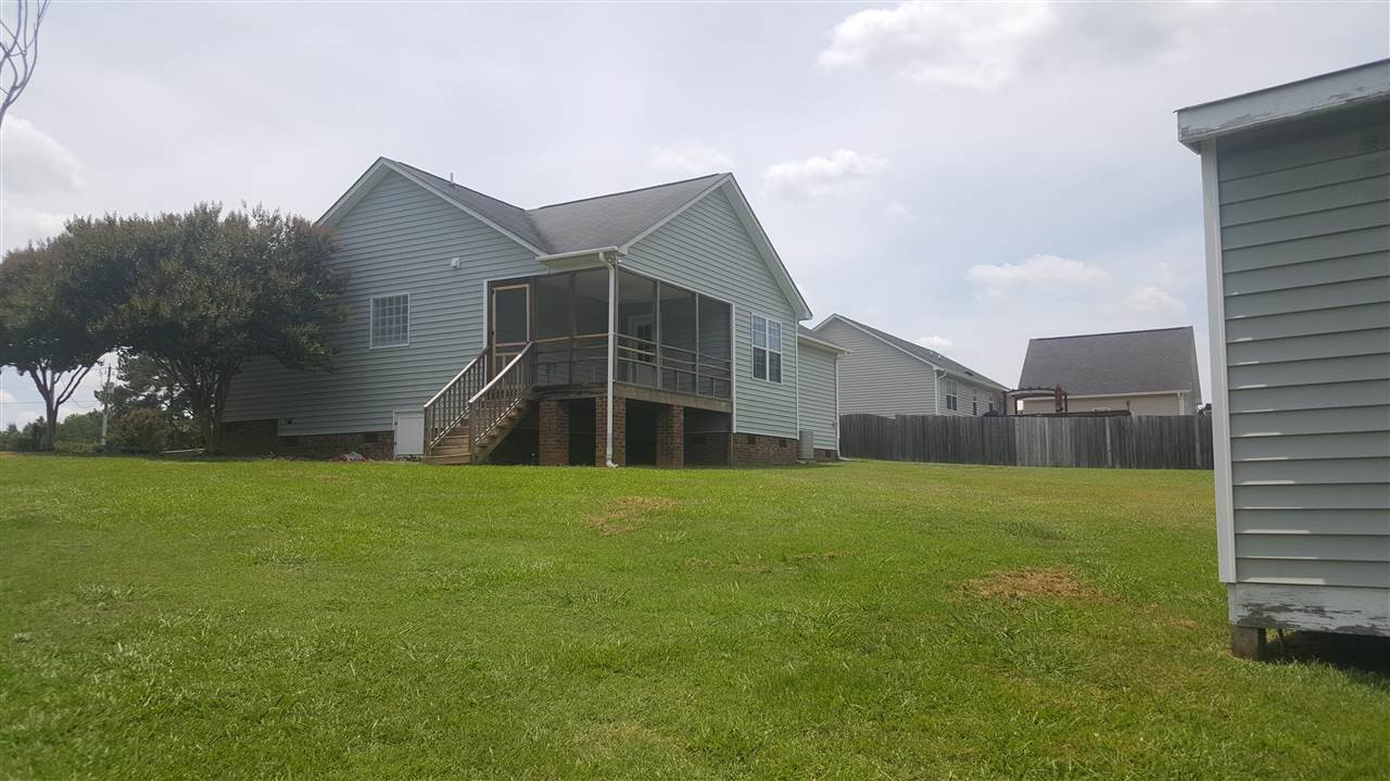 668 Slate Top House Road Clayton, NC 27520 - Photo 4 of 27 This Yard is so Spacious. One More time look at that out door living space! View From Pond Side