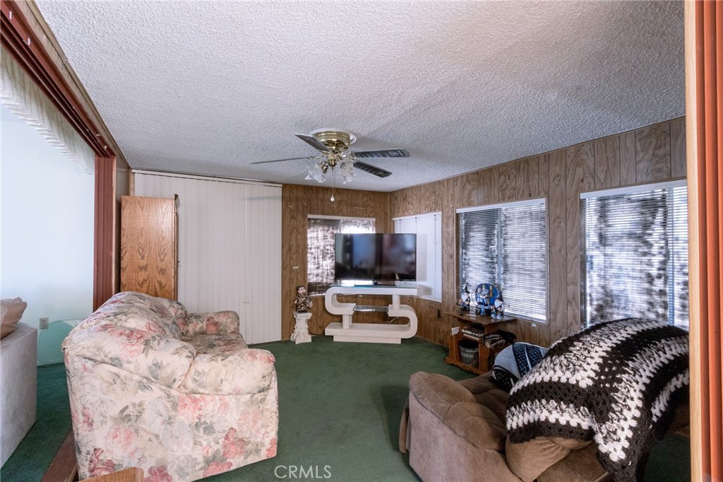 26218 McCall Boulevard Menifee, CA 92586 - Photo 25 of 33 a living room with furniture and a large window