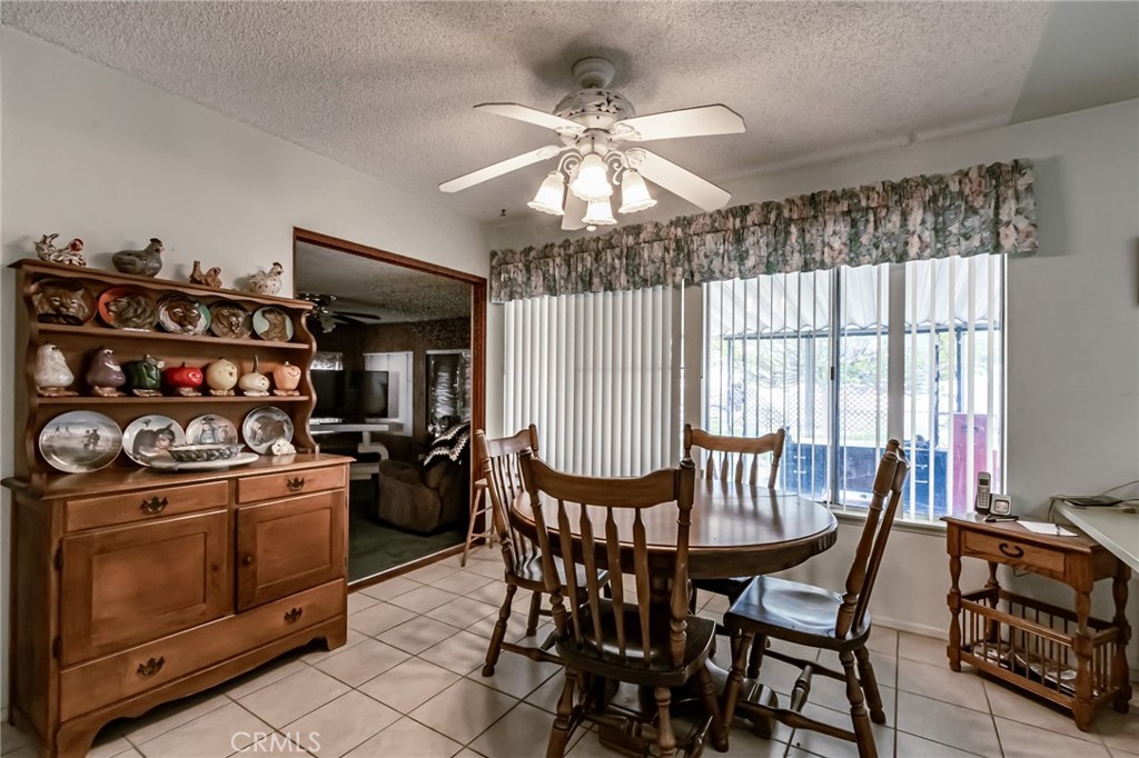 26218 McCall Boulevard Menifee, CA 92586 - Photo 26 of 33 a dining room with furniture and window