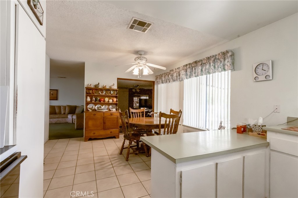 26218 McCall Boulevard Menifee, CA 92586 - Photo 30 of 33 a view of kitchen with furniture and chandelier