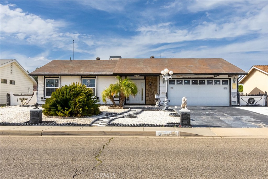 26218 McCall Boulevard Menifee, CA 92586 - Photo 4 of 33 a view of a house with entertaining space and palm trees