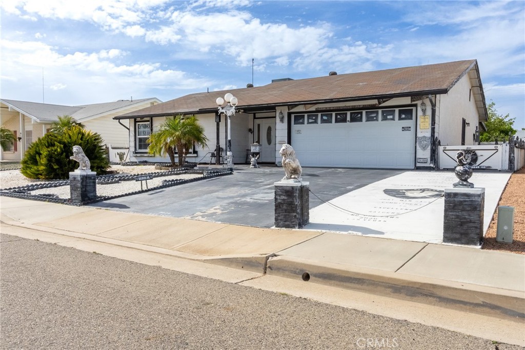 26218 McCall Boulevard Menifee, CA 92586 - Photo 5 of 33 front view of a house with a patio
