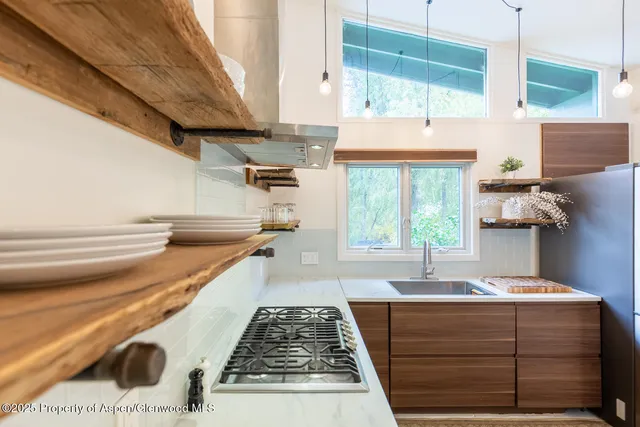 a bathroom with a bathtub and a window