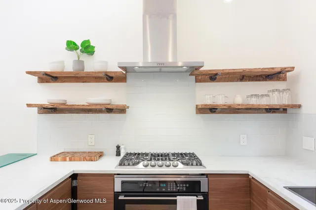 a kitchen with a stove and cabinets