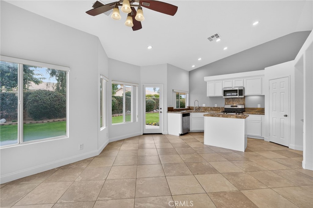 80601 Declaration Avenue Indio, CA 92201 - Photo 12 of 15 a view of kitchen with stainless steel appliances granite countertop a stove and a sink