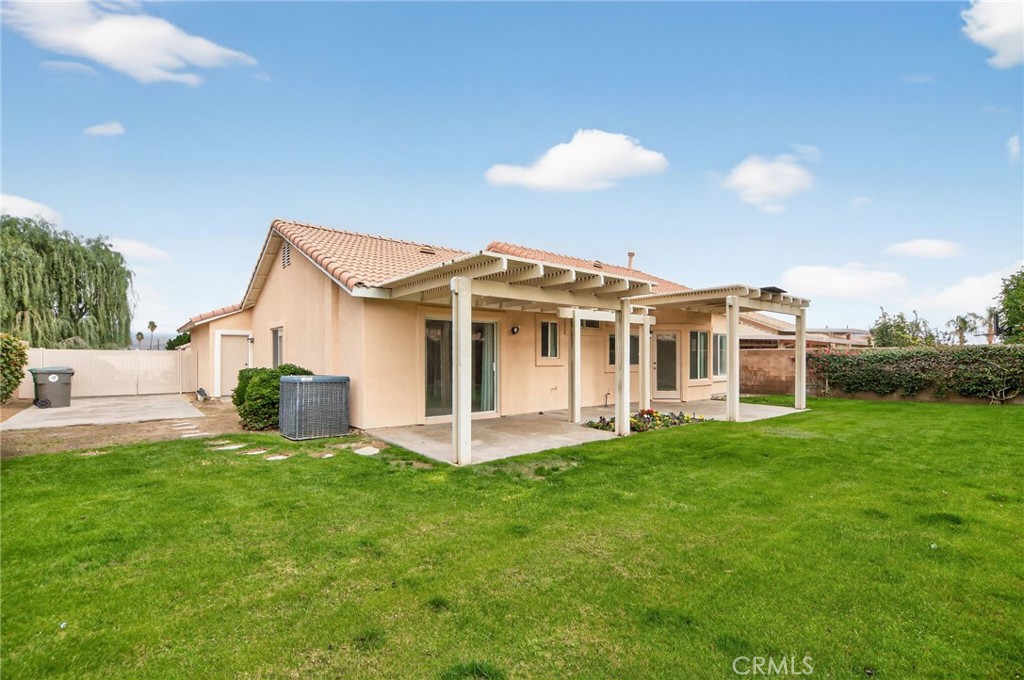80601 Declaration Avenue Indio, CA 92201 - Photo 2 of 15 a view of a house with a yard and sitting area