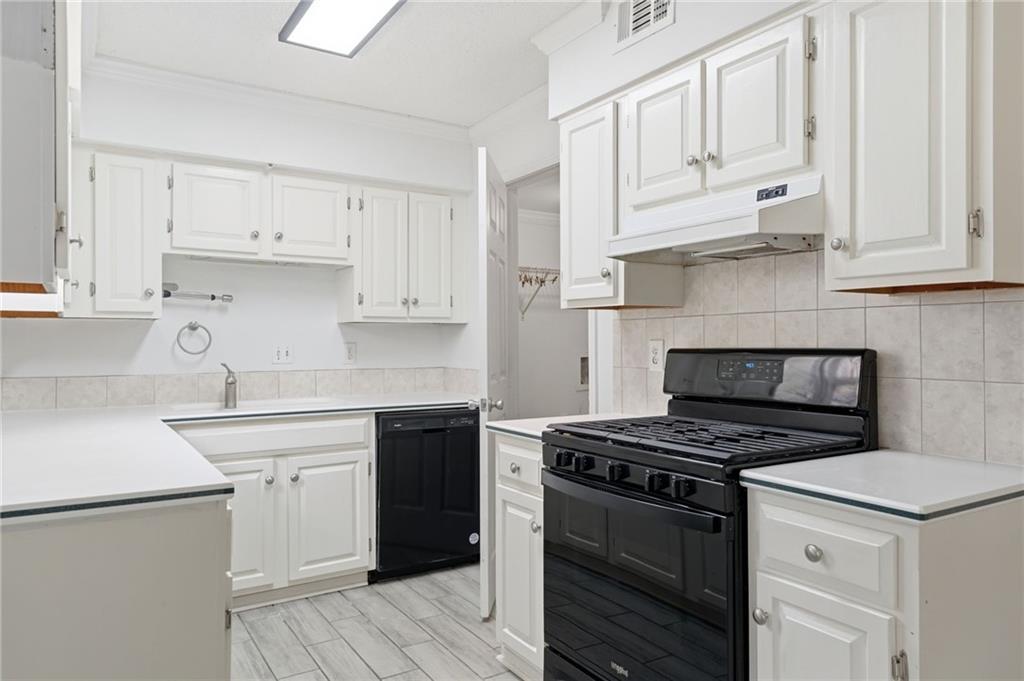 393 Promenade Court Marietta, GA 30064 - Photo 12 of 42 a kitchen with cabinets appliances and a sink