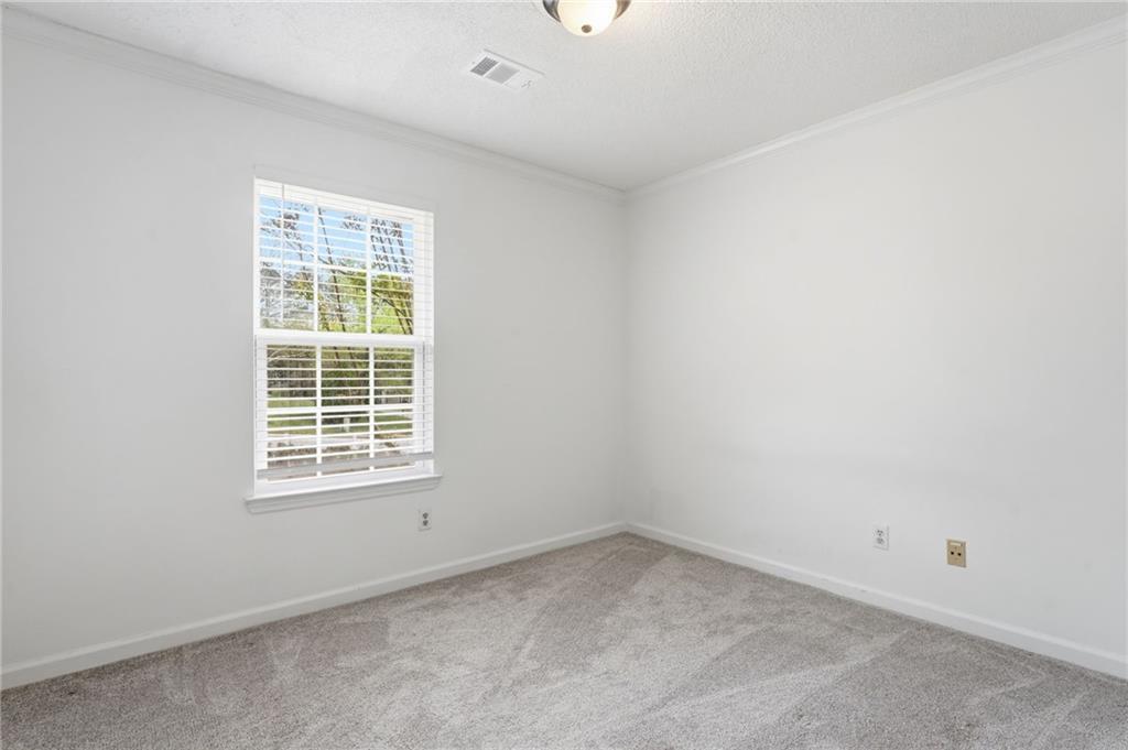 393 Promenade Court Marietta, GA 30064 - Photo 16 of 42 an empty room with a window