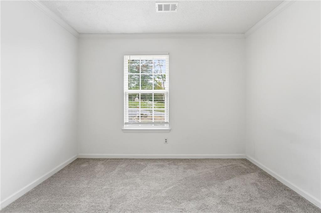393 Promenade Court Marietta, GA 30064 - Photo 18 of 42 an empty room with a window