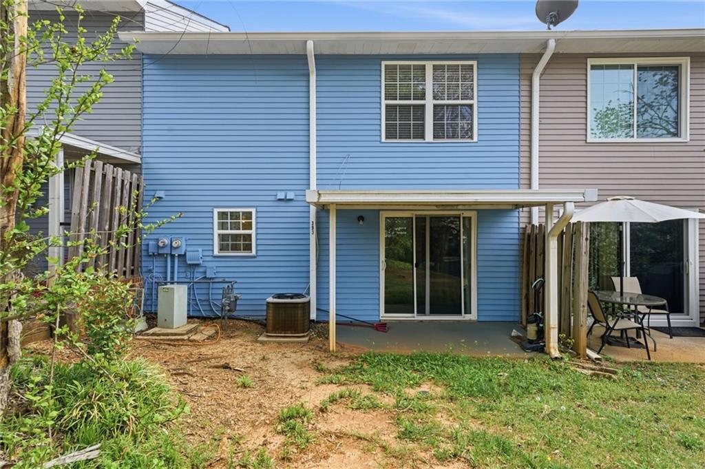 393 Promenade Court Marietta, GA 30064 - Photo 29 of 42 a view of a house with backyard and porch