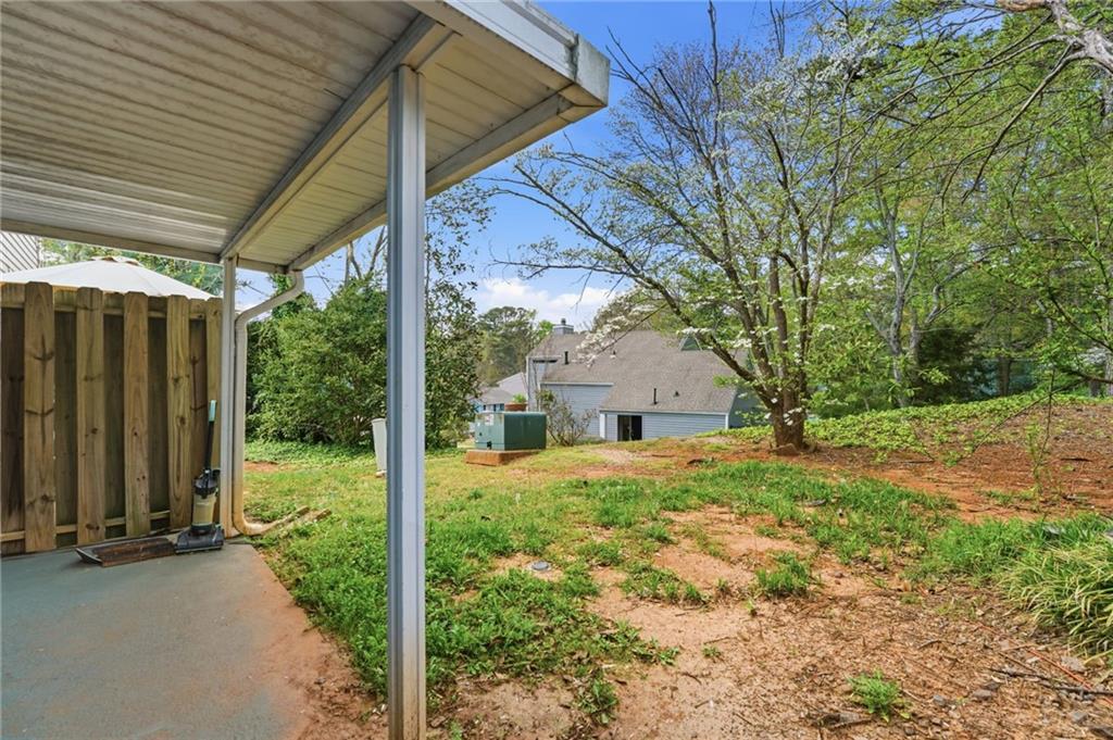 393 Promenade Court Marietta, GA 30064 - Photo 31 of 42 a view of a house with backyard and garden