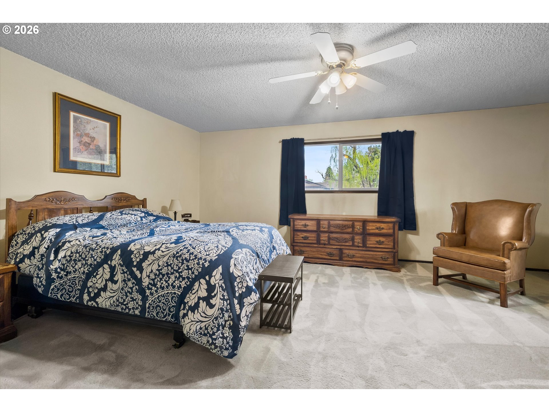 2407 Northeast Libby Place Bend, OR 97701 - Photo 13 of 23 a bedroom with a bed a couch and a flat screen tv