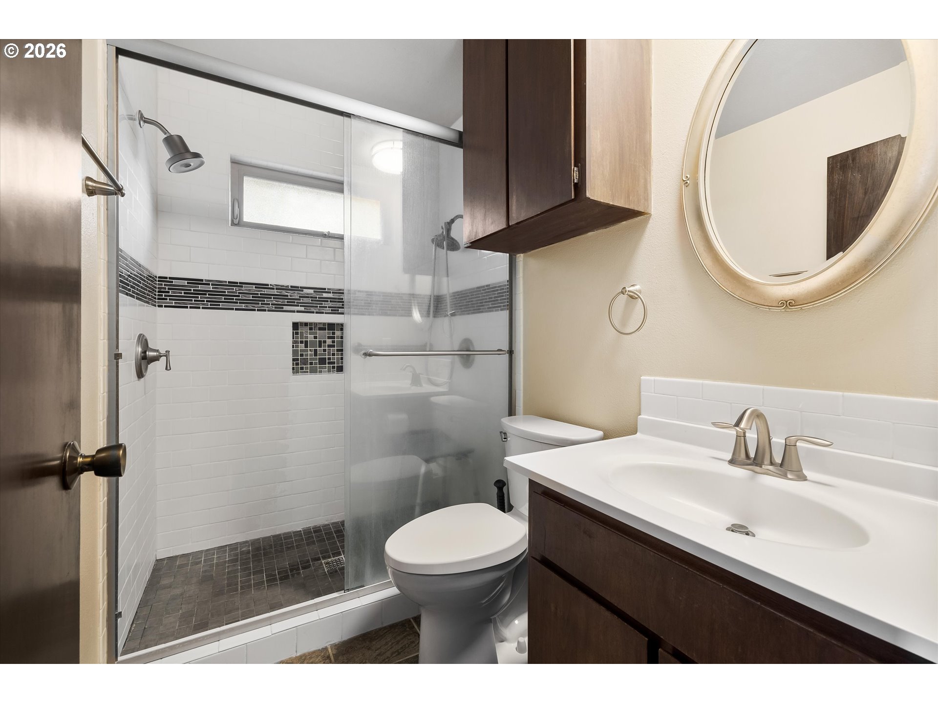 2407 Northeast Libby Place Bend, OR 97701 - Photo 16 of 23 a bathroom with a sink a toilet and a mirror