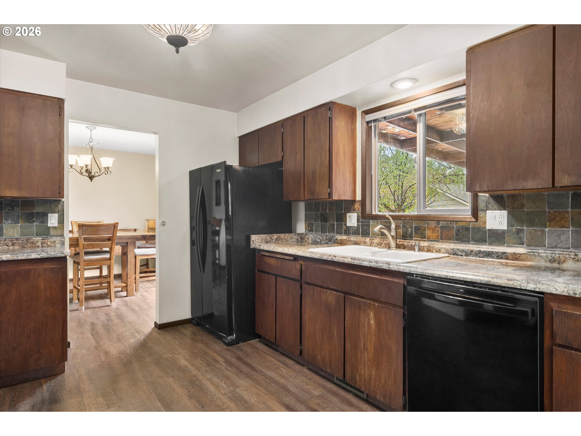 2407 Northeast Libby Place Bend, OR 97701 - Photo 7 of 23 a kitchen with stainless steel appliances granite countertop a refrigerator and a sink