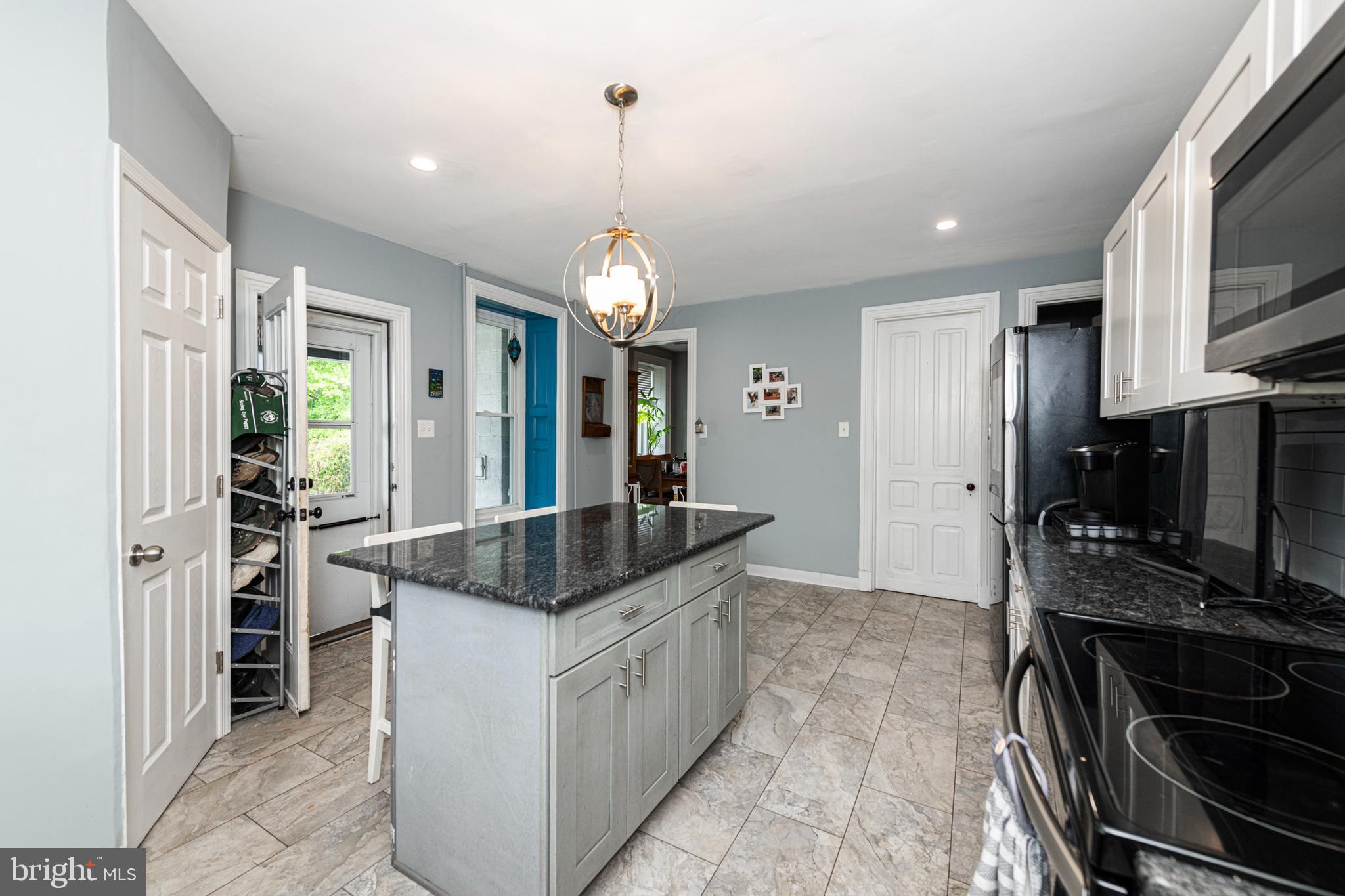 57 Longview Road Royersford, PA 19468 - Photo 11 of 53 a kitchen with stainless steel appliances granite countertop a sink and a stove