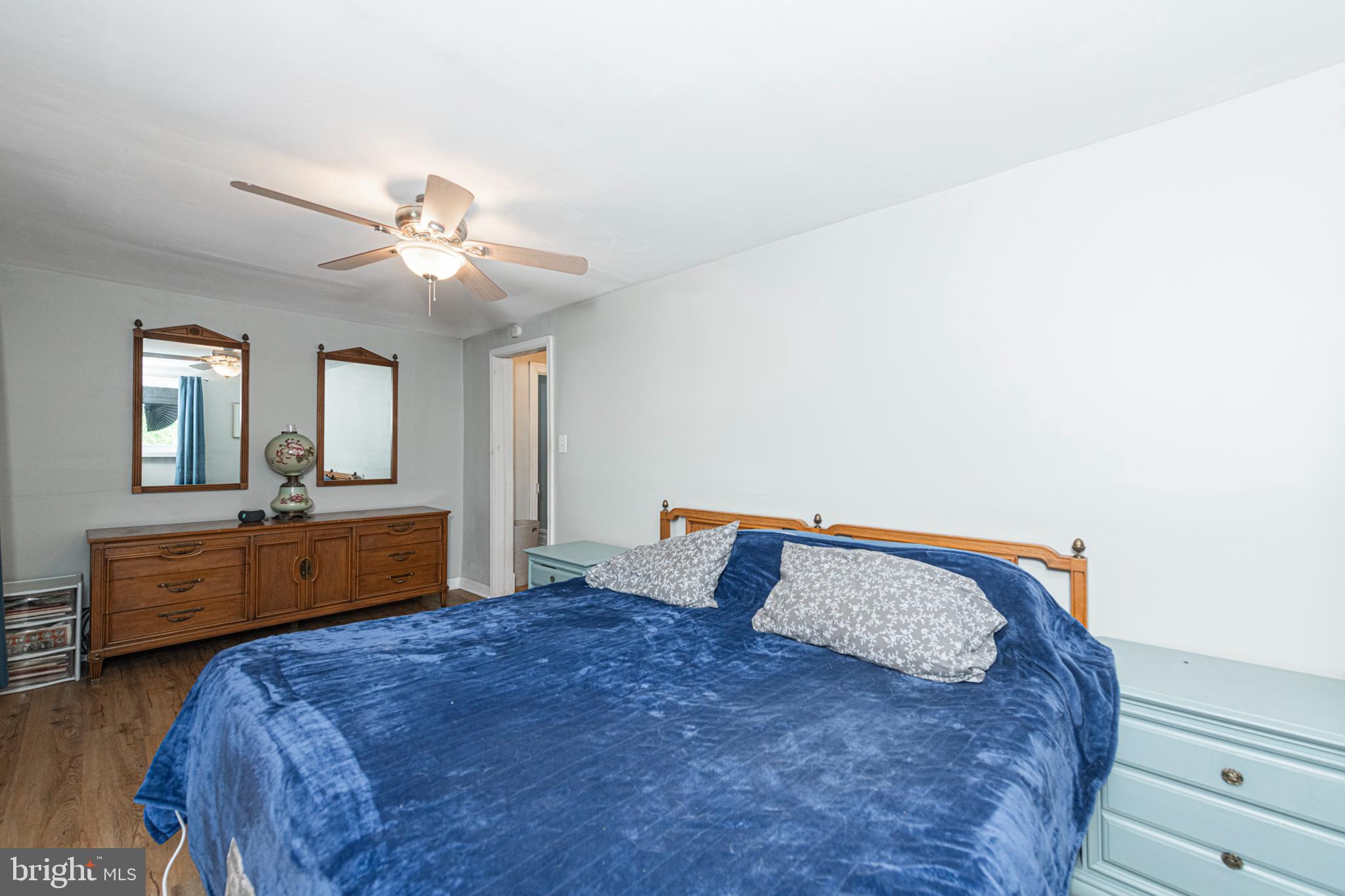 57 Longview Road Royersford, PA 19468 - Photo 32 of 53 a bedroom with a large bed and a chandelier