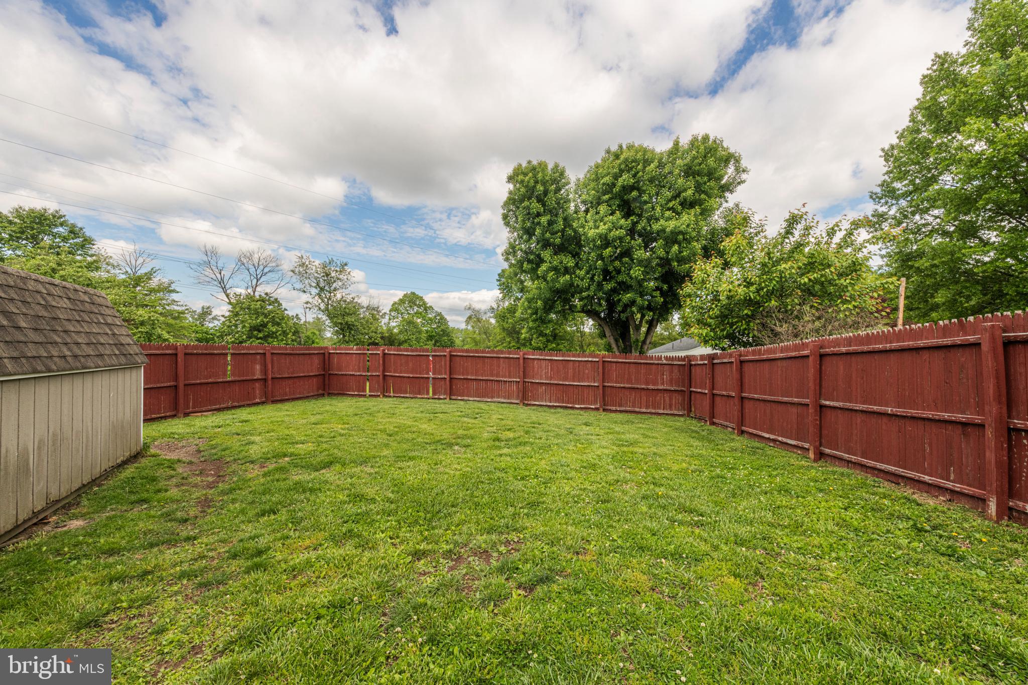 57 Longview Road Royersford, PA 19468 - Photo 45 of 53 a view of a backyard with a fence and trees