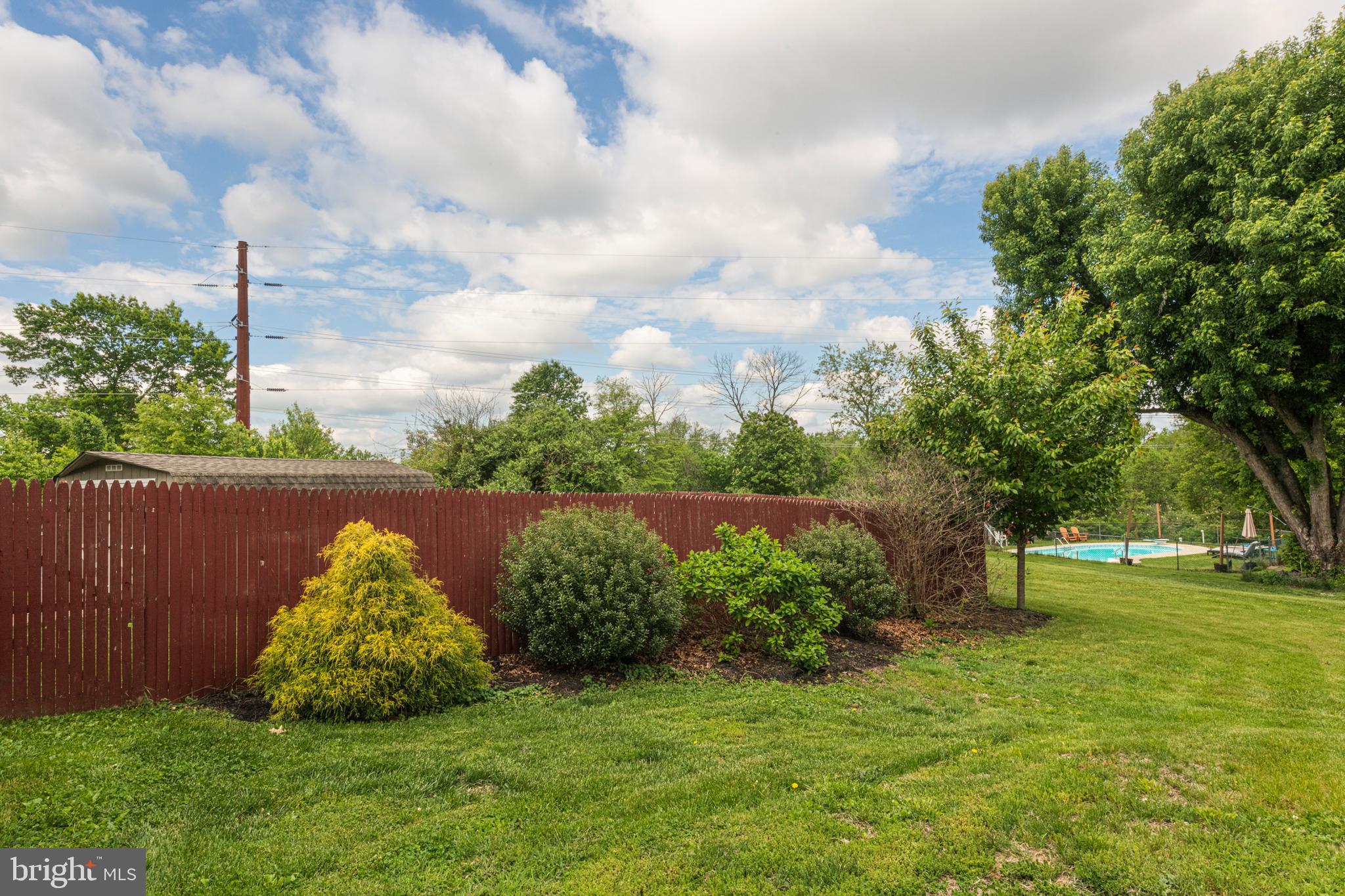 57 Longview Road Royersford, PA 19468 - Photo 48 of 53 a view of a garden with a bench in the background