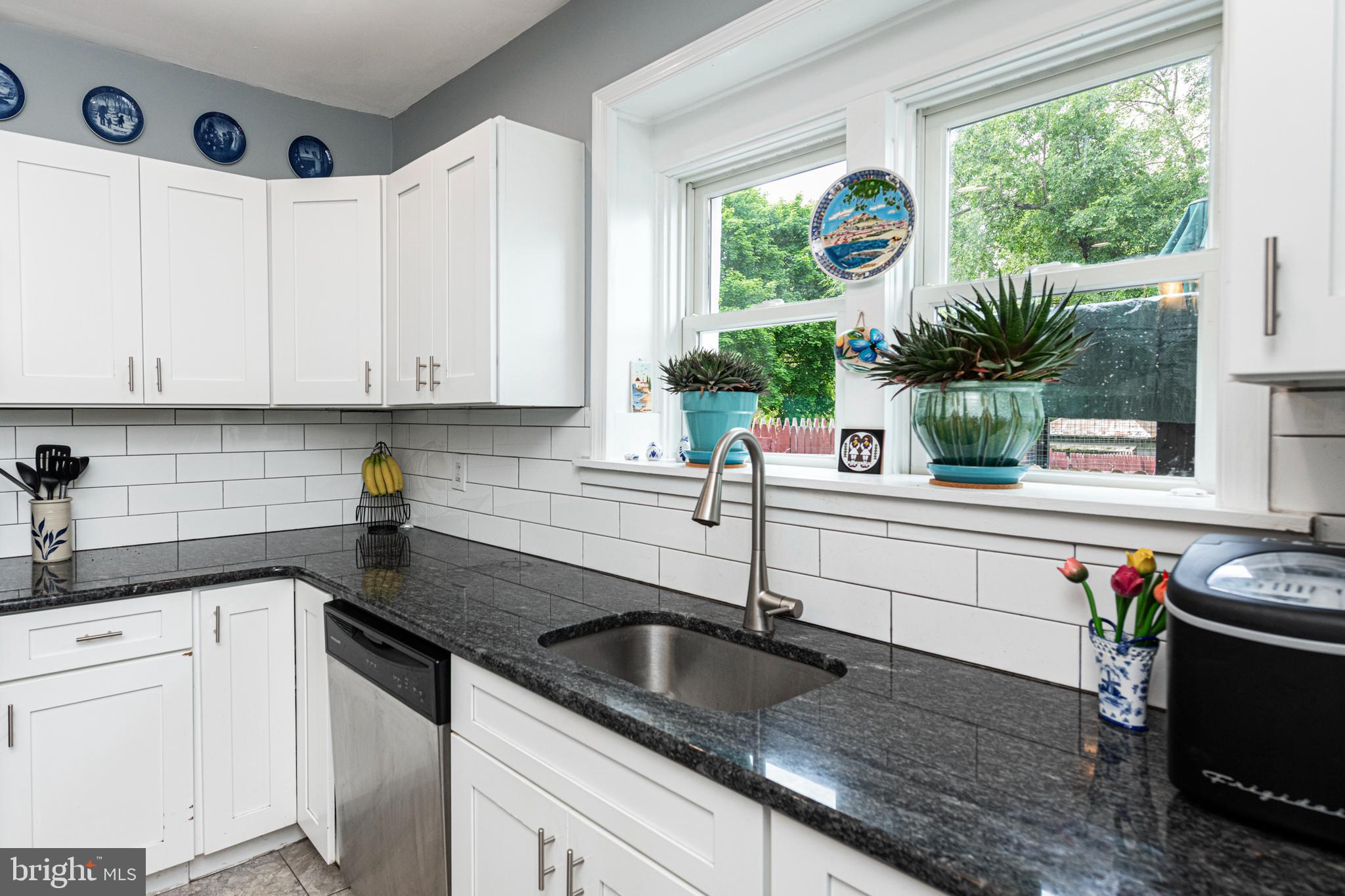 57 Longview Road Royersford, PA 19468 - Photo 9 of 53 a kitchen with granite countertop a sink and a white wooden cabinets