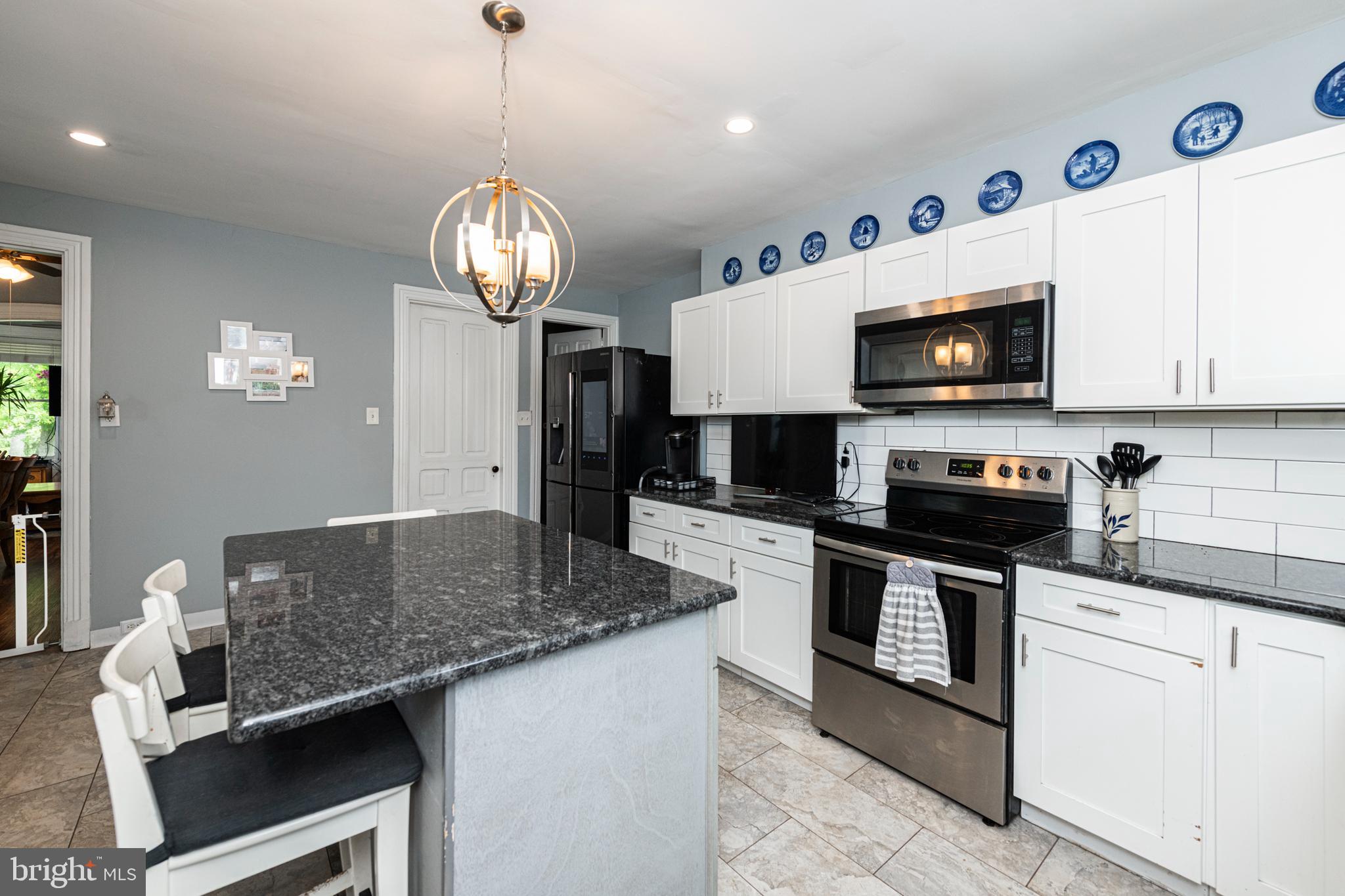 57 Longview Road Royersford, PA 19468 - Photo 10 of 53 a kitchen with a center island and stainless steel appliances