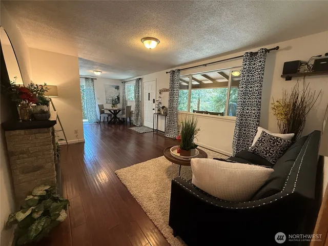 a bedroom with a bed a table and chair