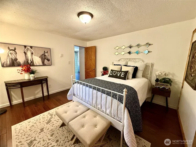 a bed room with a bed window and a table