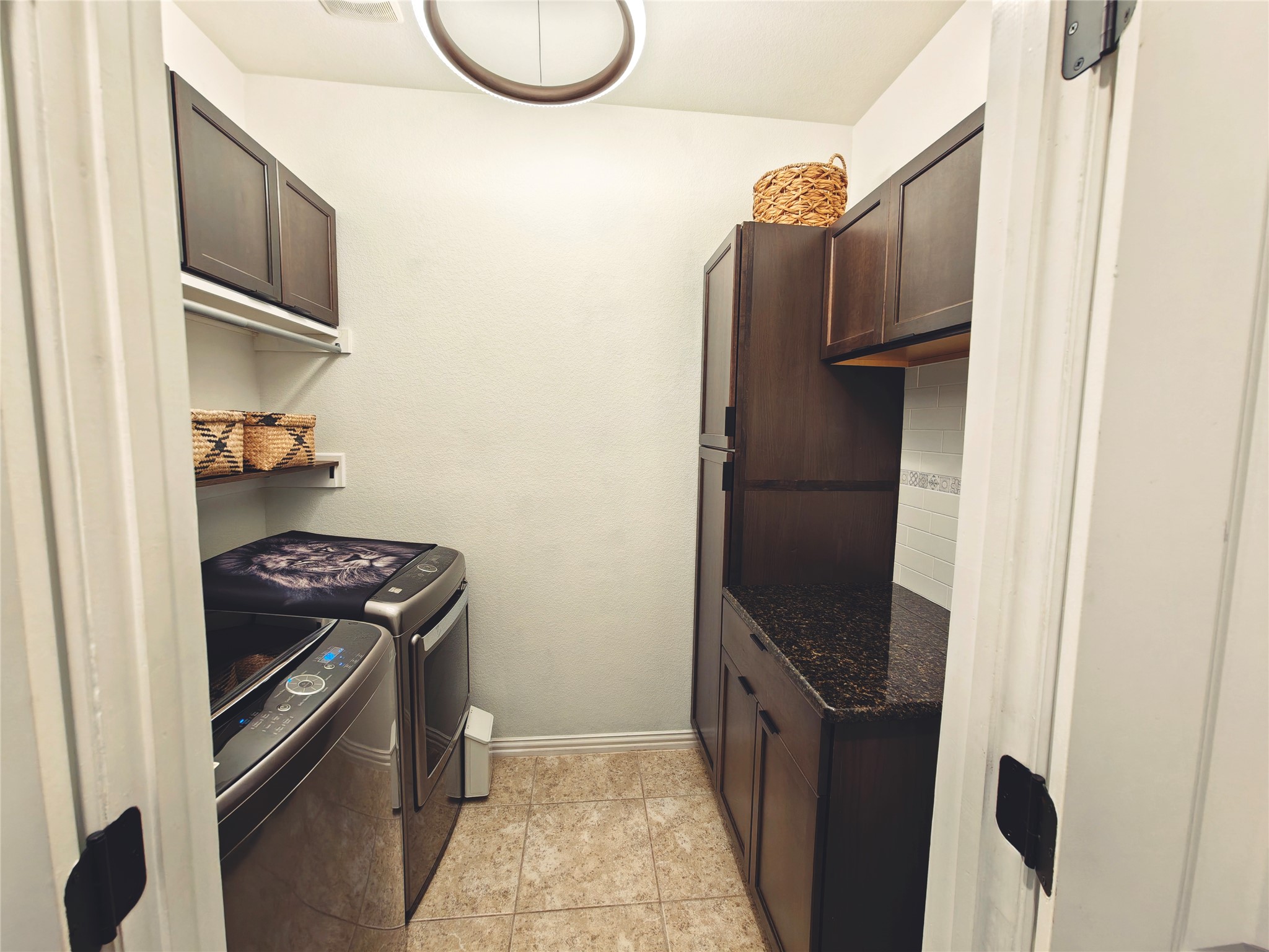7613 Turnback Ledge Trail Lago Vista, TX 78645 - Photo 16 of 40 a kitchen with a stove and a refrigerator