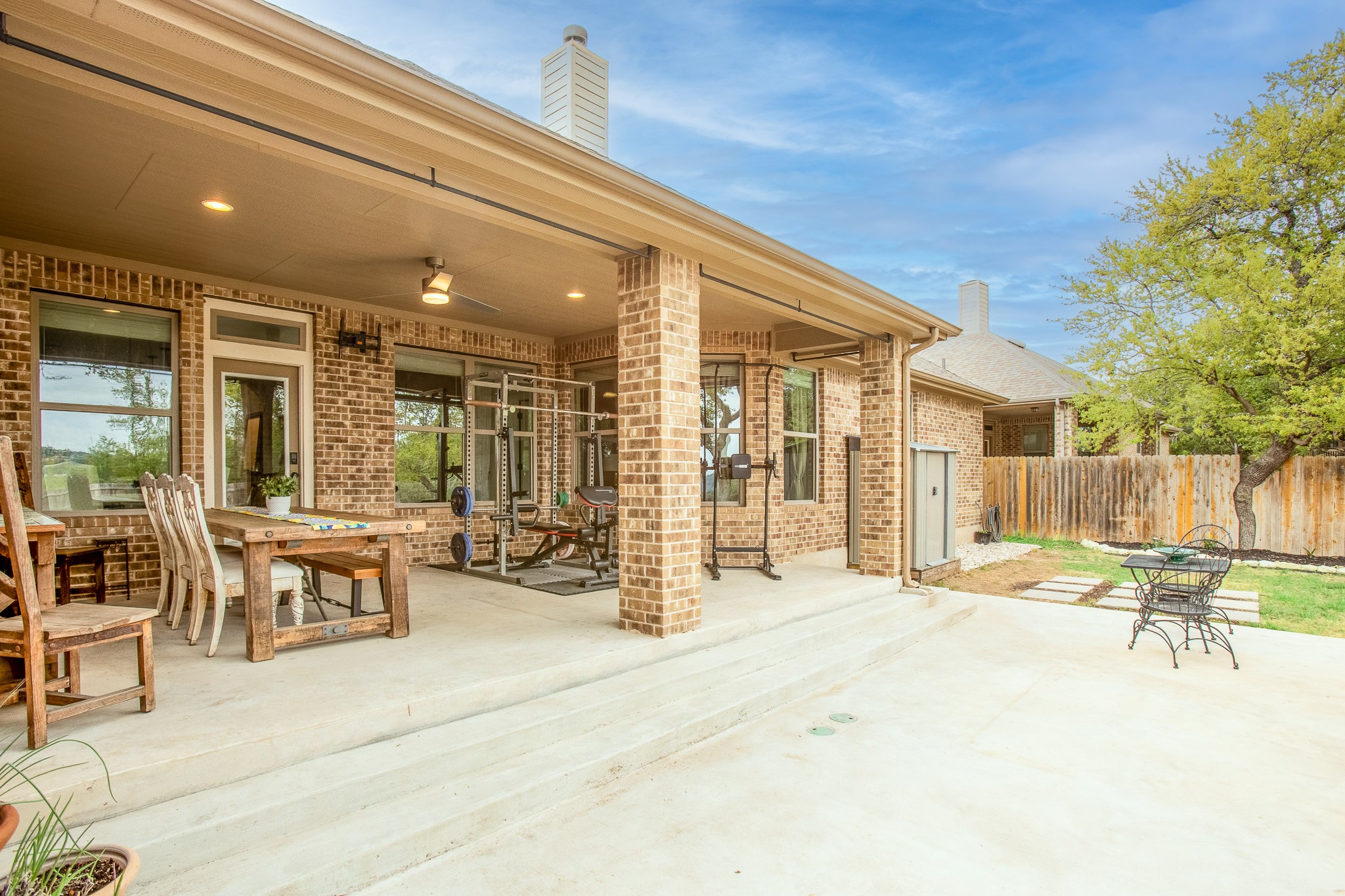 7613 Turnback Ledge Trail Lago Vista, TX 78645 - Photo 25 of 40 a swimming pool with outdoor seating and yard