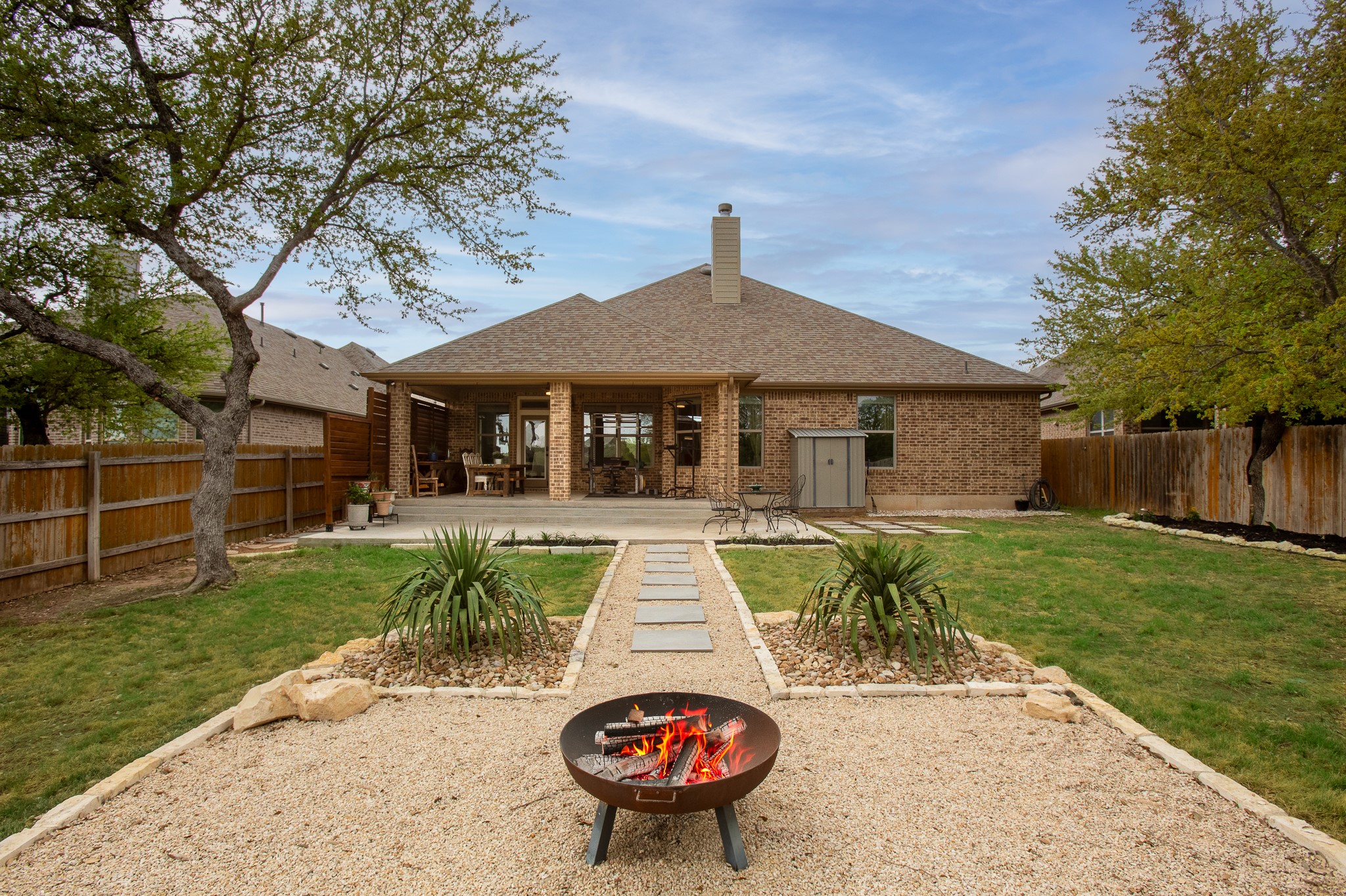 7613 Turnback Ledge Trail Lago Vista, TX 78645 - Photo 26 of 40 a view of a house with backyard and pool