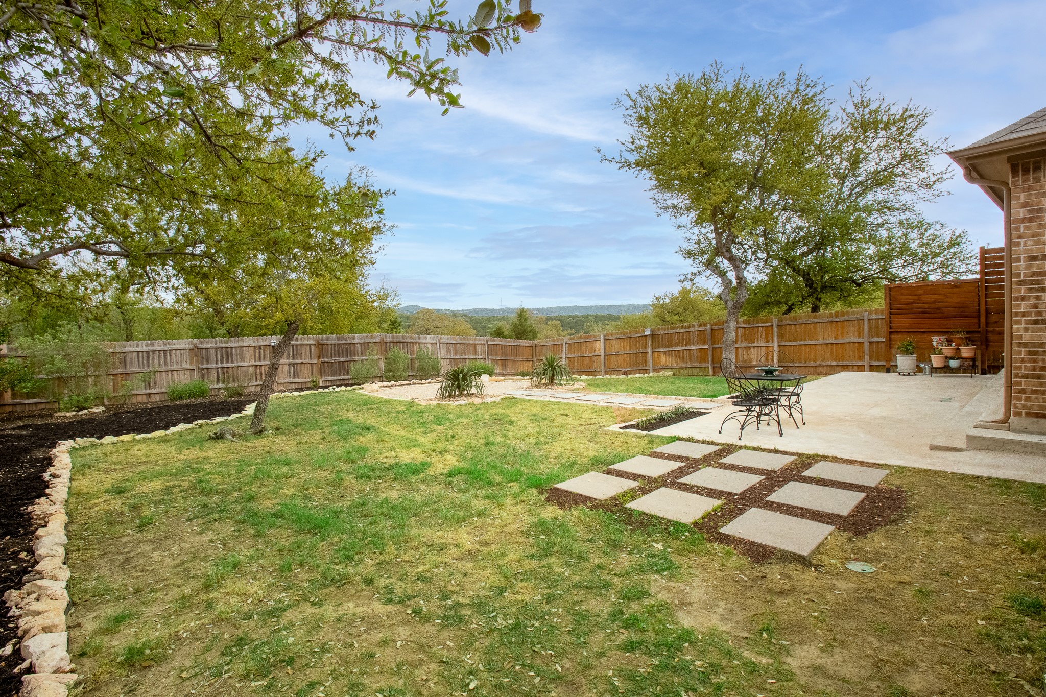 7613 Turnback Ledge Trail Lago Vista, TX 78645 - Photo 32 of 40 a view of yard with swimming pool