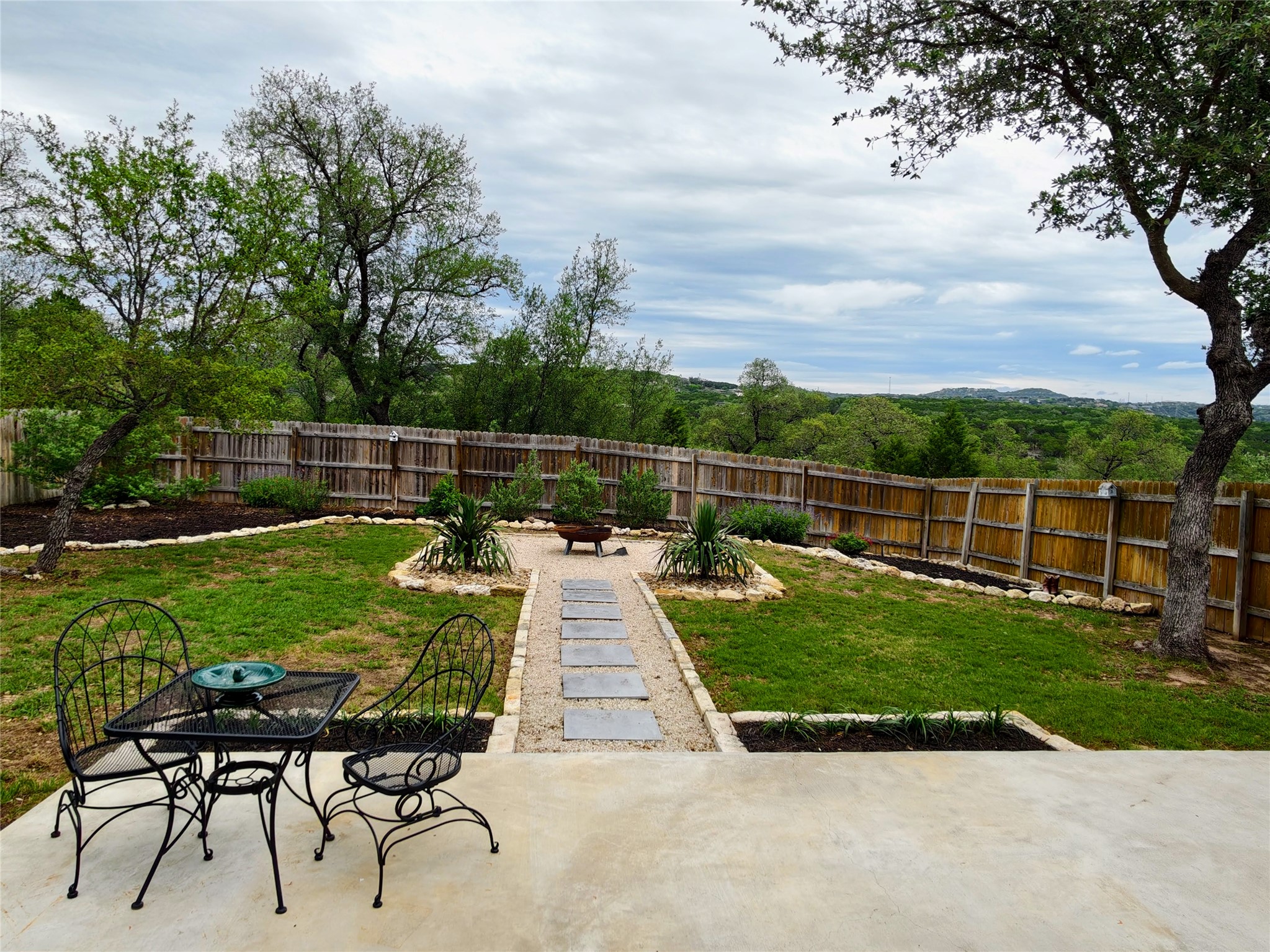 7613 Turnback Ledge Trail Lago Vista, TX 78645 - Photo 36 of 40 a view of a backyard with sitting area