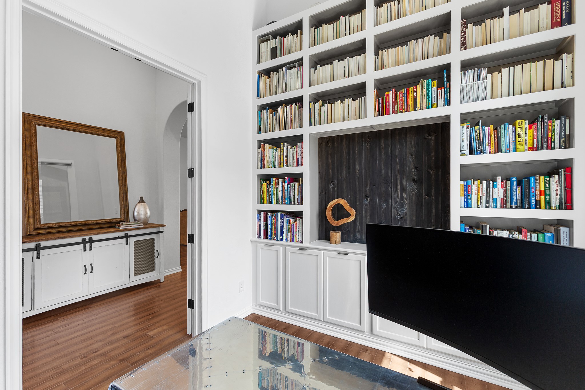 7613 Turnback Ledge Trail Lago Vista, TX 78645 - Photo 4 of 40 Office with dark wood-style flooring and built in shelves