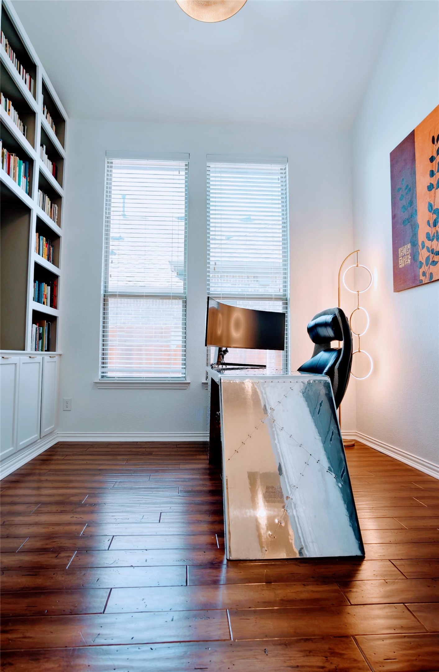 7613 Turnback Ledge Trail Lago Vista, TX 78645 - Photo 5 of 40 a room with wooden floor and windows