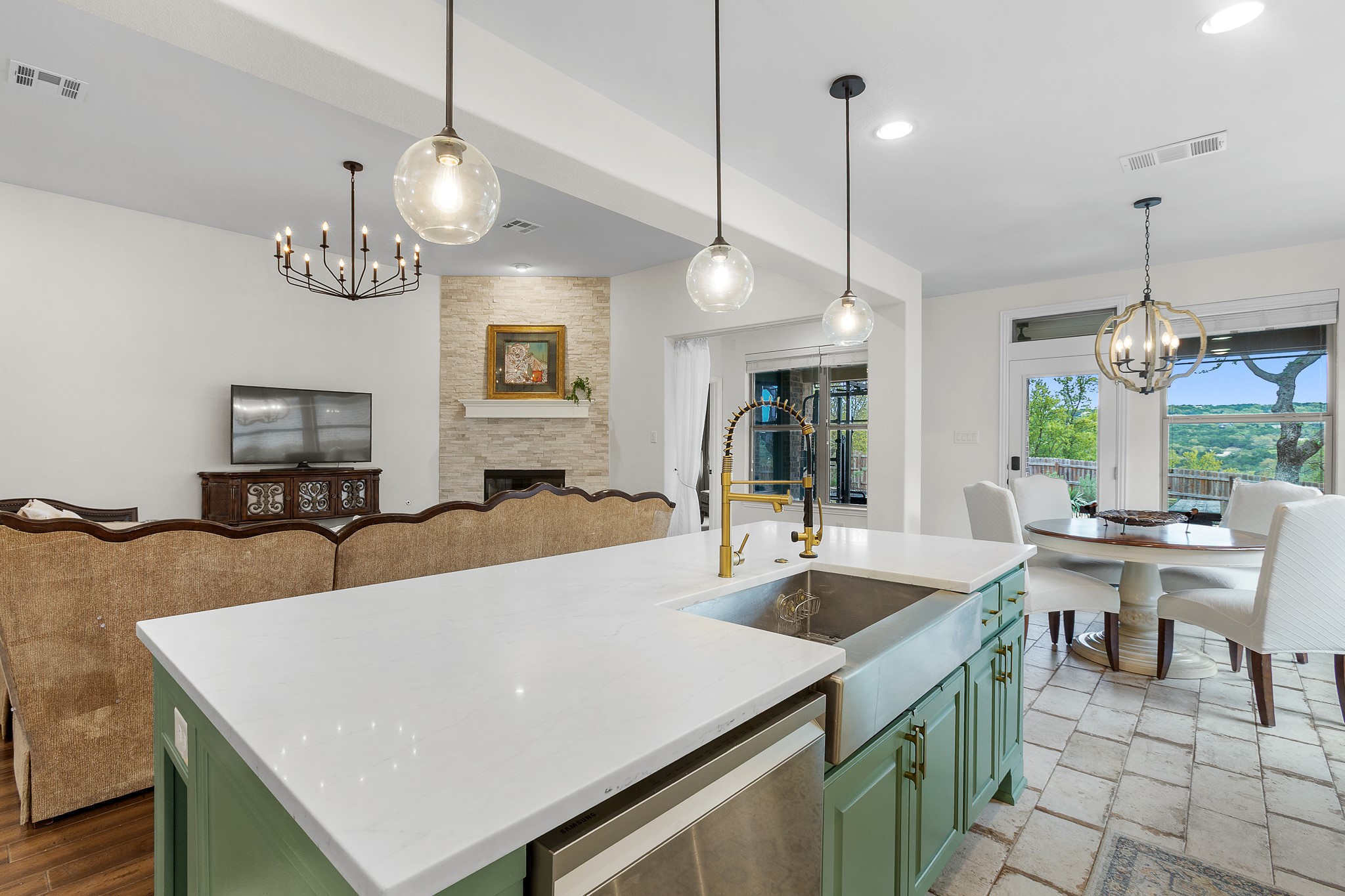 7613 Turnback Ledge Trail Lago Vista, TX 78645 - Photo 7 of 40 Kitchen island with white countertop, farmhouse sink, and green cabinetry