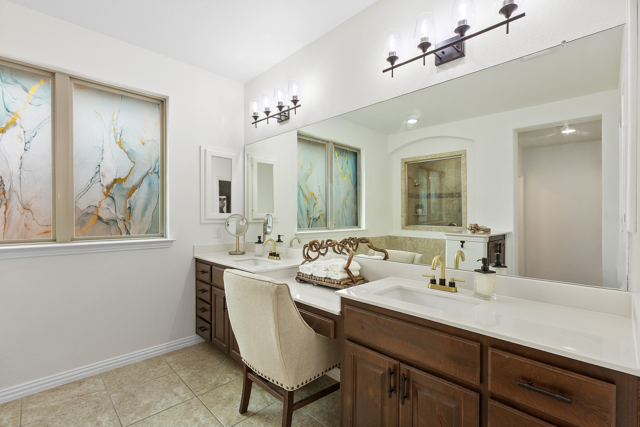 7613 Turnback Ledge Trail Lago Vista, TX 78645 - Photo 10 of 40 a bathroom with a sink and a mirror