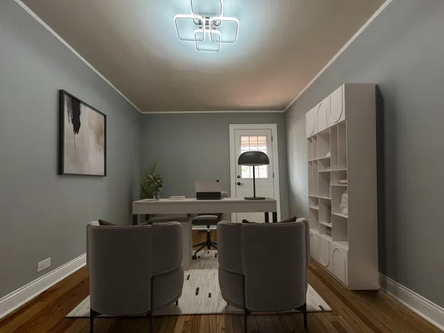 a view of a dining room with furniture and a potted plant
