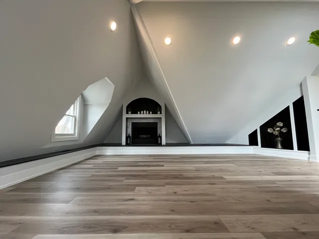 a view of an empty room and a window