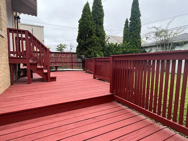 a view of deck with wooden floor and seating space