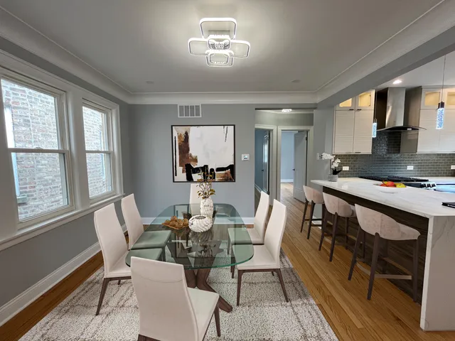 a dining room with furniture and window