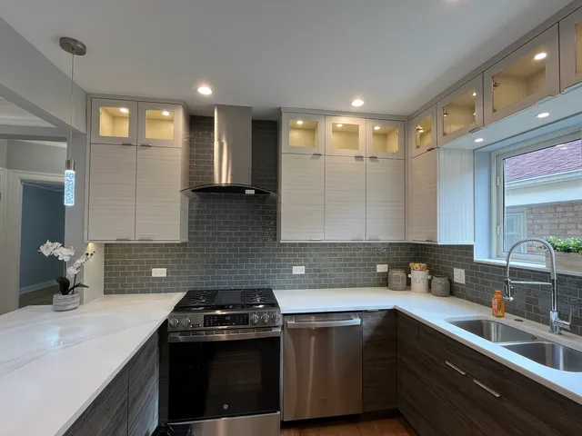 a kitchen that has a sink and a stove