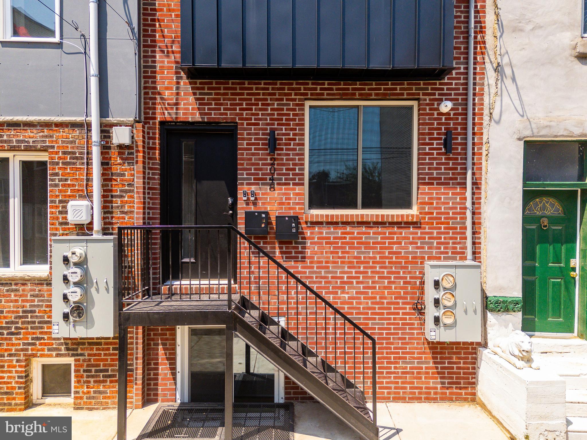 2048 North 3rd Street, Unit 2 Philadelphia, PA 19122 - Photo 21 of 27 a view of front door of house with stairs