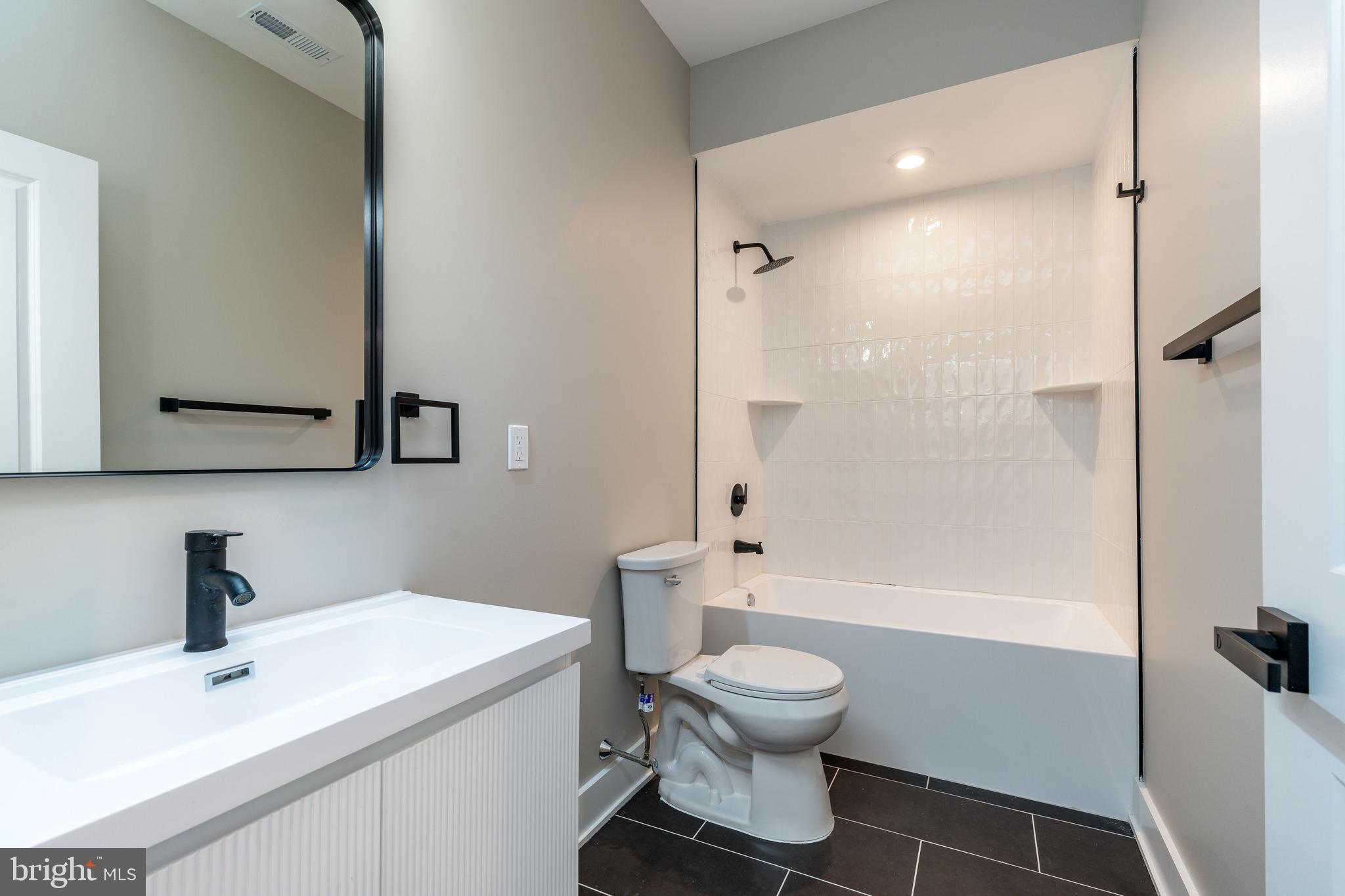 2048 North 3rd Street, Unit 2 Philadelphia, PA 19122 - Photo 7 of 27 a bathroom with a sink toilet and shower