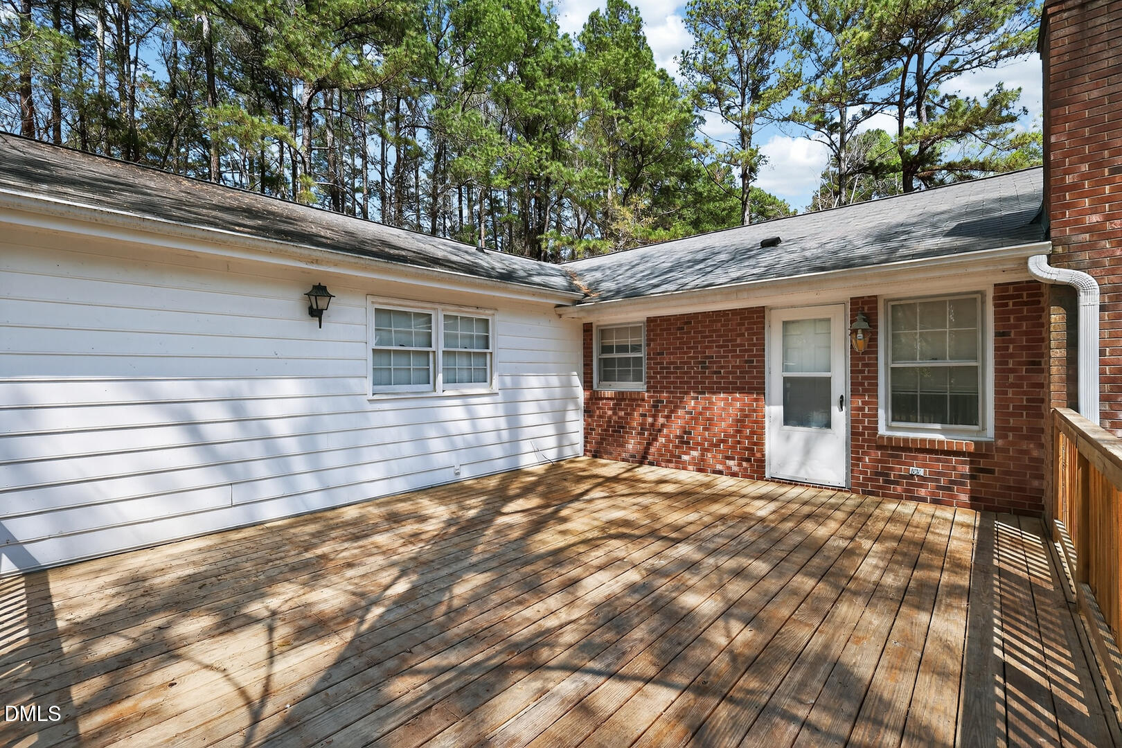 1620 Wait Avenue Wake Forest, NC 27587 - Photo 44 of 55 a view of a house with a large window and wooden fence