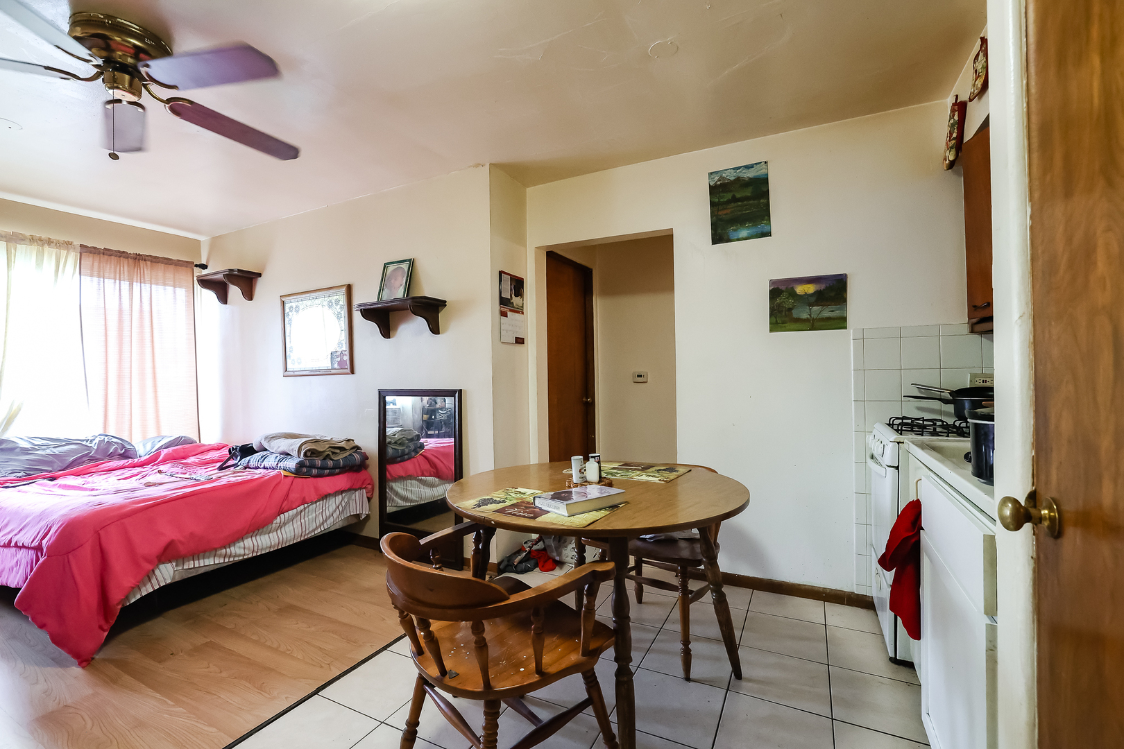 7242 Roosevelt Road Forest Park, IL 60130 - Photo 21 of 36 a bedroom with a bed and a table in it