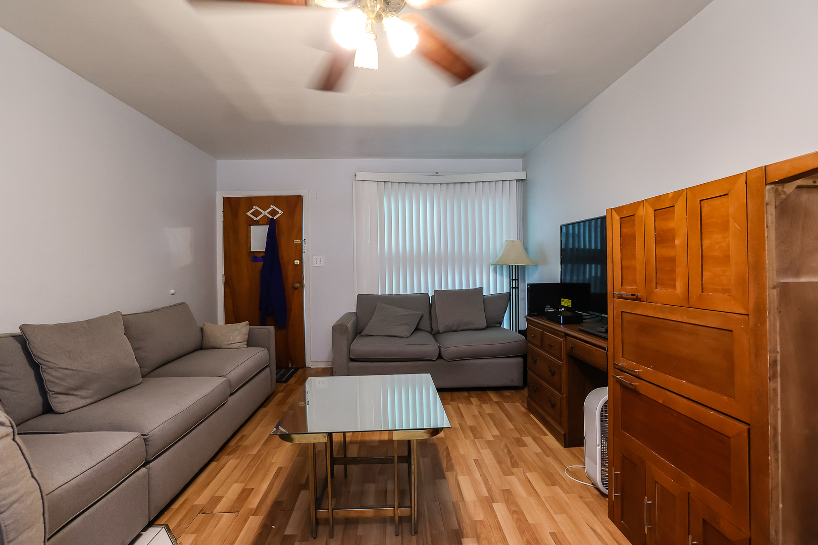 7242 Roosevelt Road Forest Park, IL 60130 - Photo 25 of 36 a living room with furniture and a wooden floor