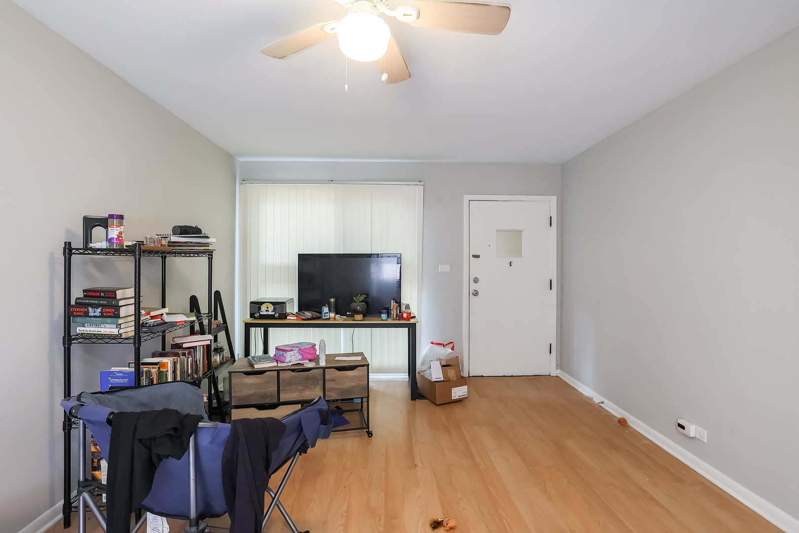 7242 Roosevelt Road Forest Park, IL 60130 - Photo 32 of 36 a bedroom with furniture and a flat screen tv